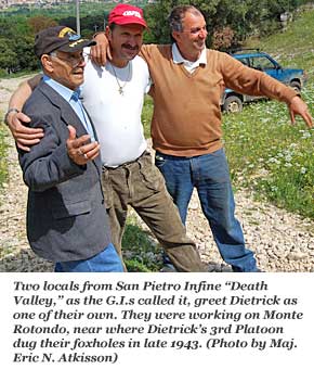 Men from the area embrace the returning veteran